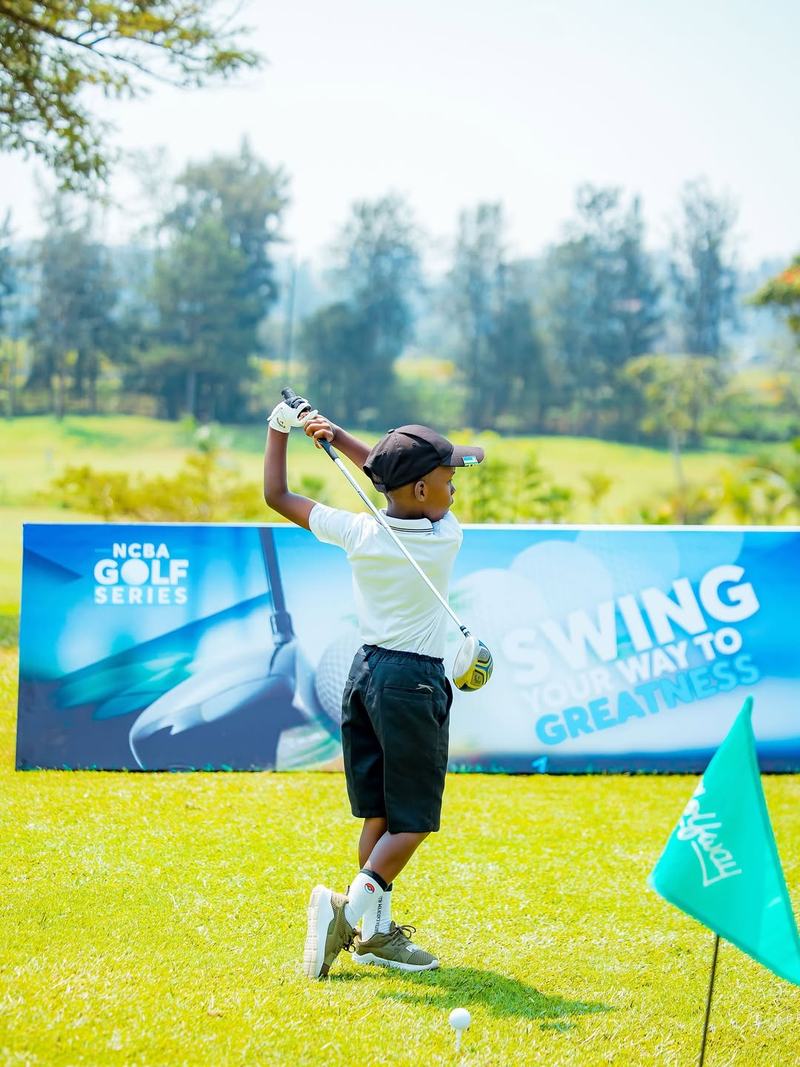 Junior boy swinging at NCBA Golf Series Rwanda Kigali