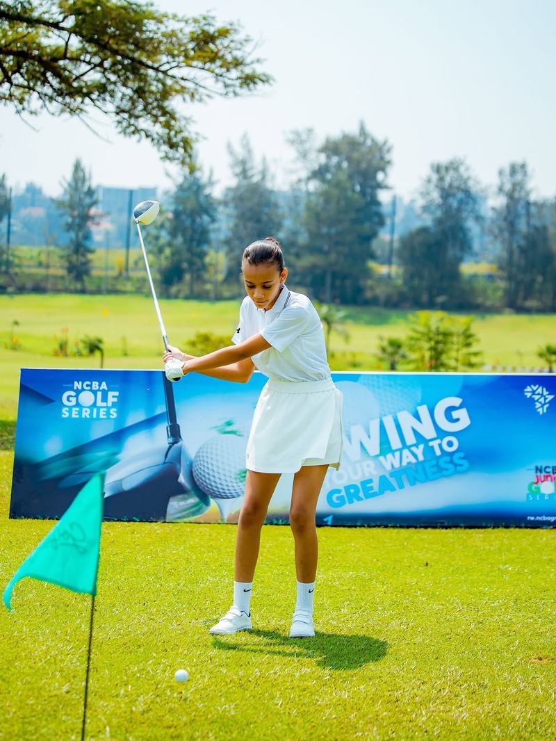 Junior girl addressing the ball at NCBA Golf Series Rwanda