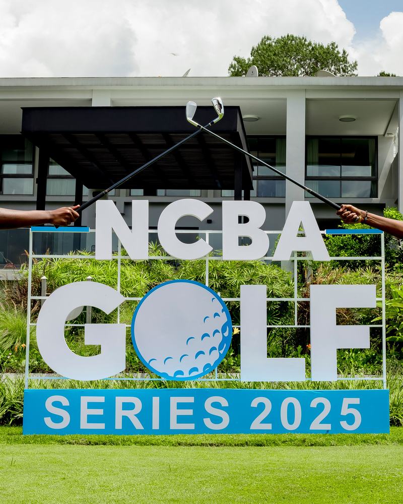 Two golfers crossing bridge