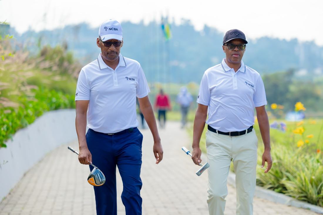 Two golfers walking and talking